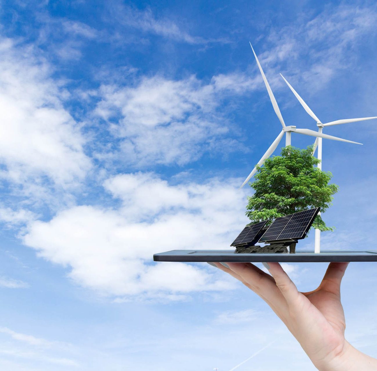 ecological-system-solar-energy-city-hand-holding-tablet